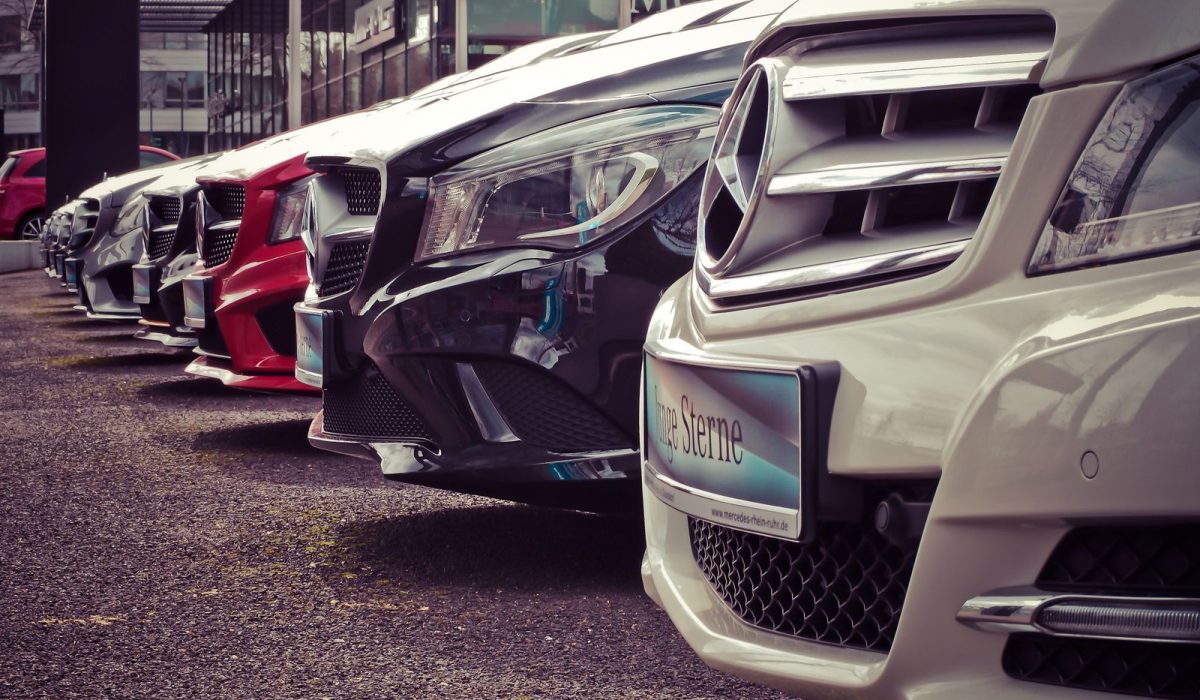 Row of cars lined up at a rental lot